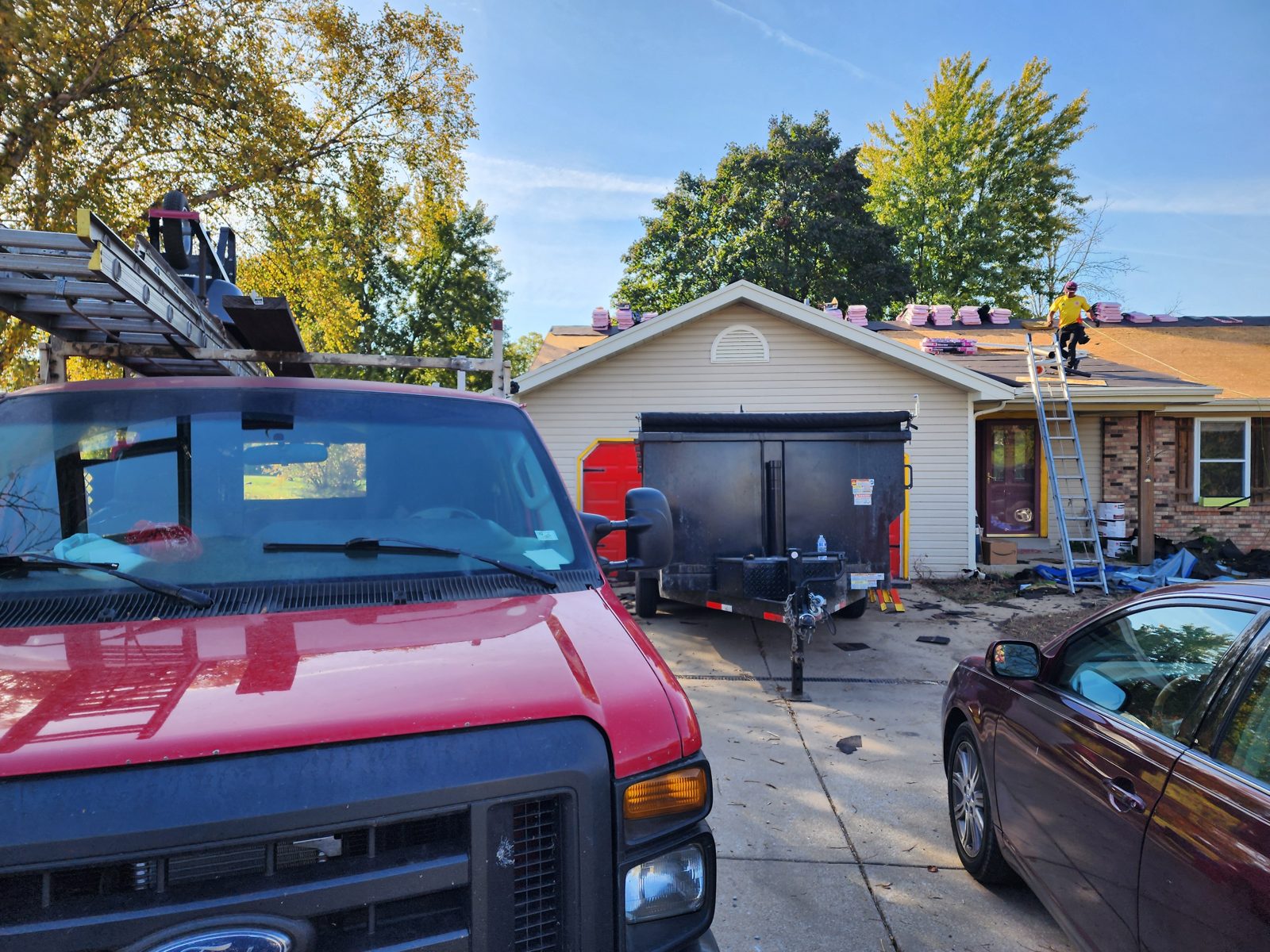 Crew tearing off an old roof